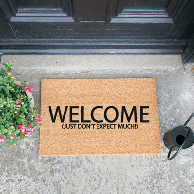 Welcome Don't Expect Much Doormat - The Pack Design